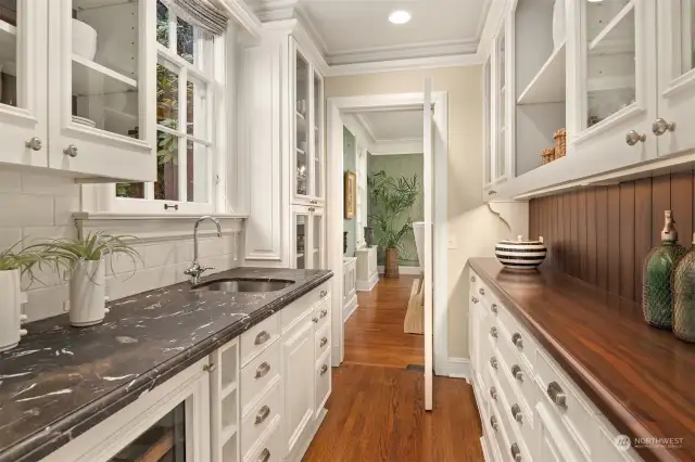 Large butler pantry between kitchen and dining room.