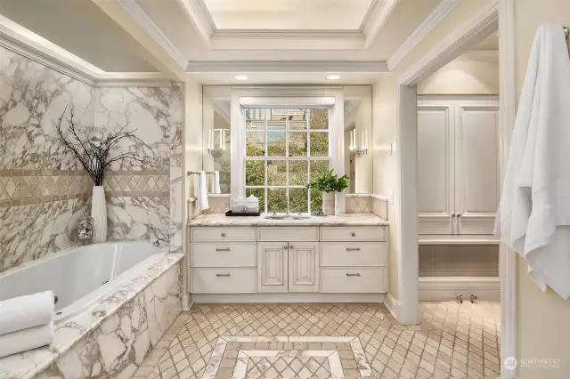 Elegant primary bath with marble details throughout.