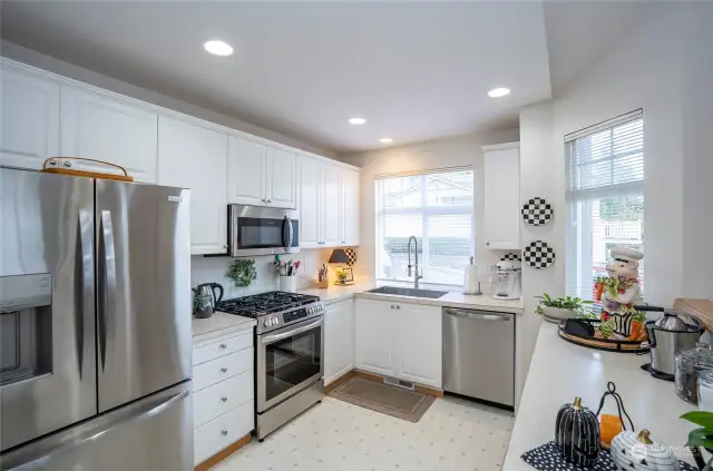 Large kitchen with new matching stainless steel appliances