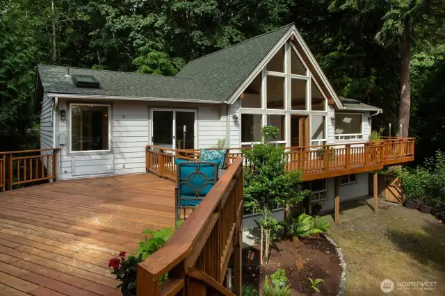 East side of home has deck that overlooks the ravine & gardens.