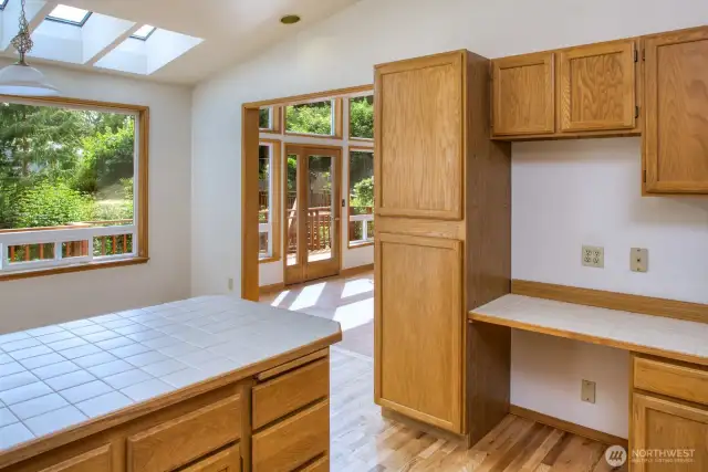 Sunny dining space with built in office nook.