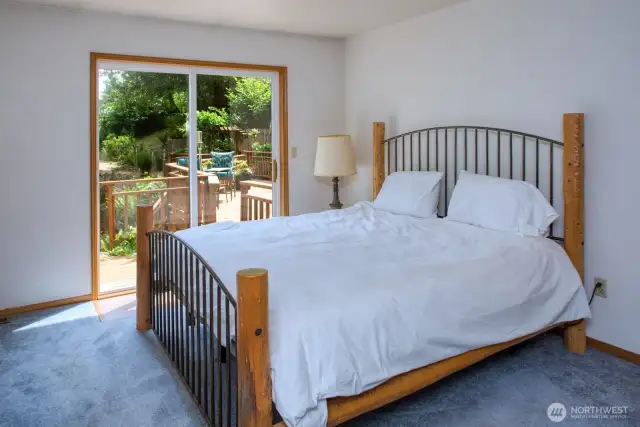 Primary main bedroom with sliders to the deck.