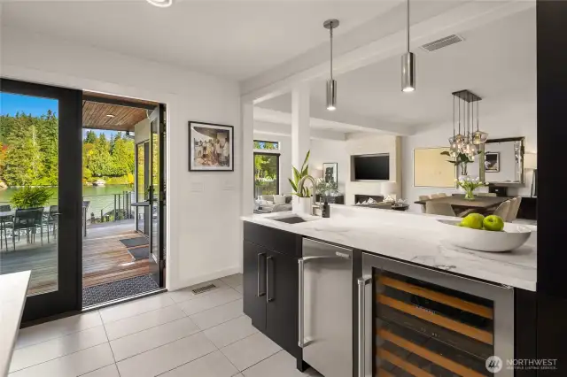 Wet bar is ideal for entertaining with a sink, Subzero ice maker and wine fridge