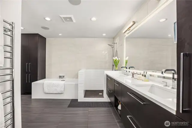 Luxurious primary bath with walk-in shower and separate soaking/bubble tub
