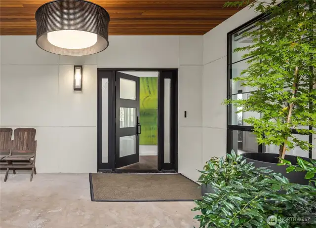 Covered entry with wood ceiling