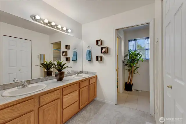 Double sinks, walk in closet to the right and there is a pocket door to the shower AND a door to the water closet. Tons of privacy!