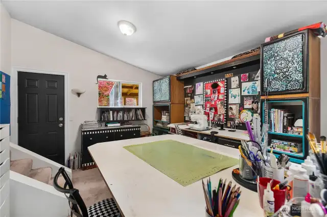 Used as a craft room this bedroom has separate outside entrance and is off the main floor just a few steps down.
