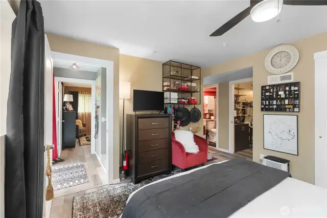 One of primary suites with bathroom, tub and shower with office or den or extra closet space.