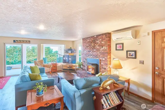 Pretty brick fireplace anchors the living area.