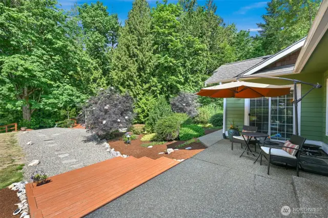 The back patio of the main house.  The path leads to the cabana and then to the well house.