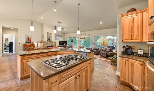 Two islands in the kitchen!  The first for cooking and keeping spices close to you and the second larger island is your eating bar.  The living area wraps around the kitchen.