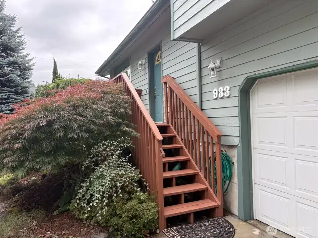 A charming front landing welcomes you and your guests—ideal for a warm hello and a peek at the front garden.