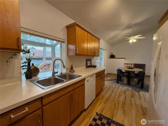 From the kitchen sink, enjoy a clear view into the dining area—perfect for staying connected while entertaining or prepping meals. The open layout makes the most of every square foot.