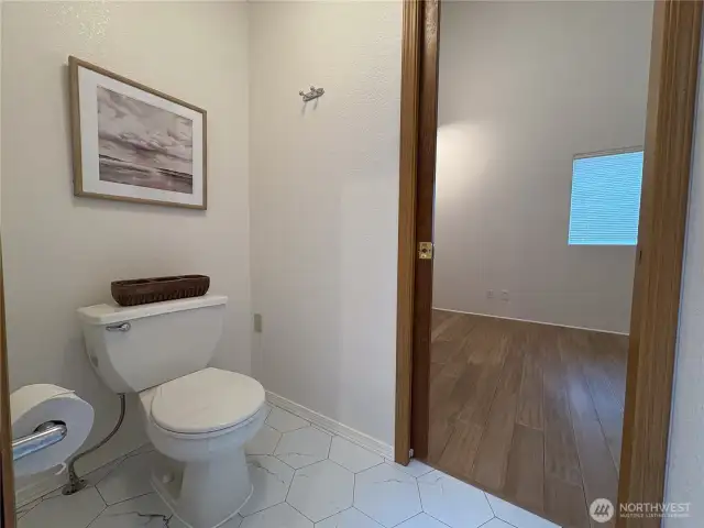The private toilet room offers unexpected space and comfort—wide and thoughtfully designed for ease of use and added privacy.