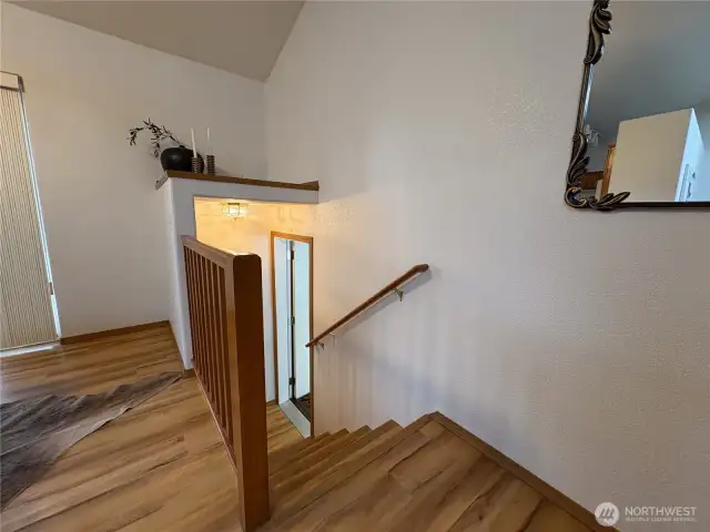 A short flight of stairs leads directly to the attached two-car garage—making comings and goings easy, with convenient access to storage and parking.