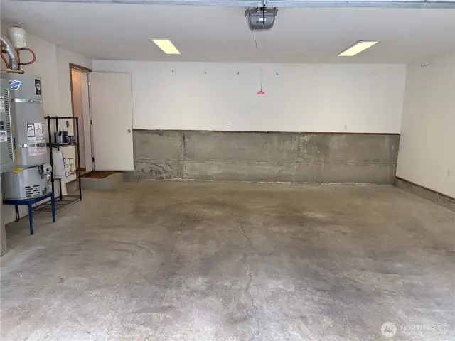 The oversized two-car garage offers more than just parking—enjoy extra depth for storage.