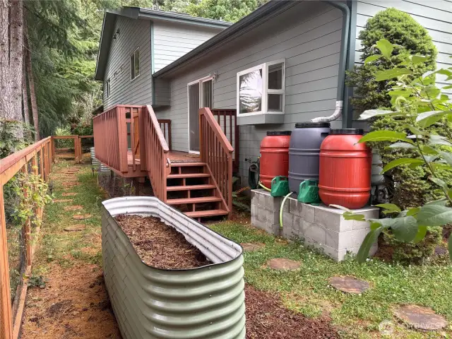 Turning the corner, you'll find a reclaimed water system used to nourish the garden—an eco-friendly solution that helps keep things green while saving on the water bill.