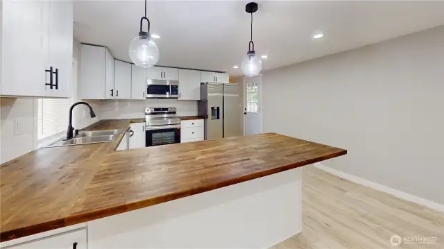 Additional view of the kitchen.