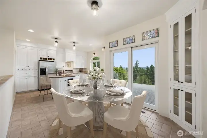 Beautiful stain glass in the Dining area with access to deck. Virtually staged