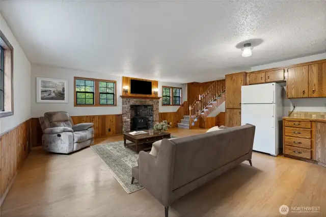 Gather around the wood fireplace on cozy winter nights in your 932 sq ft cabin. Virtually staged.