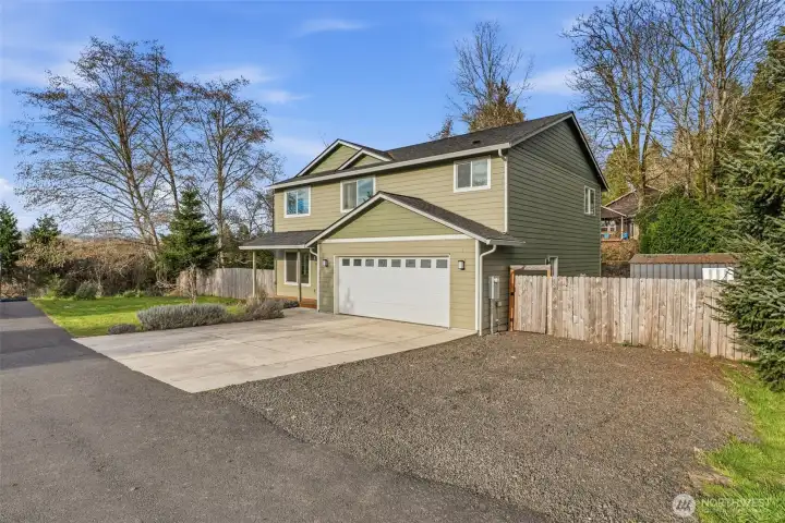 Newer 2373 sq foot home on 2 levels - partially fenced, RV/boat parking plus attached 2 car garage...