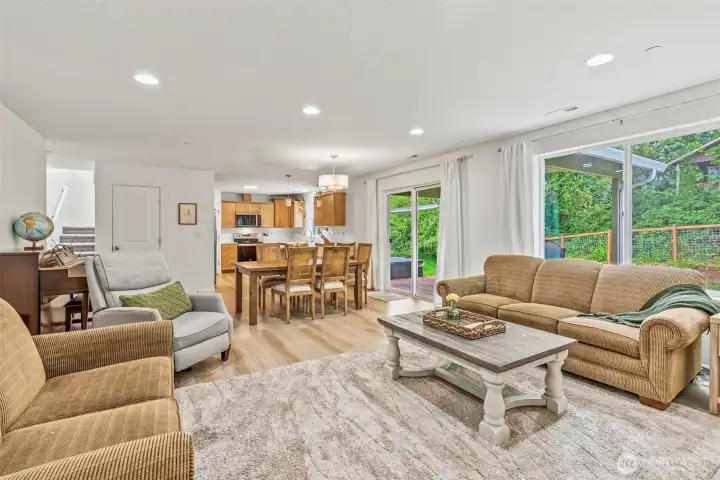Fabulous open concept with viewing area straight through to kitchen. Solid surfaces and life-proof flooring, slider to covered back deck, large pantry and spacious dining...