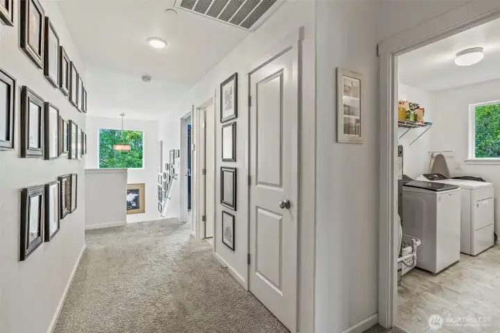 Wide hallways and high ceilings - upper laundry...