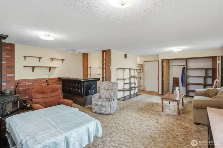 Behind the wet bar is 4 cabinets (2 upper and 2 lower not visible).  Also note the very large closets at the back of the room.