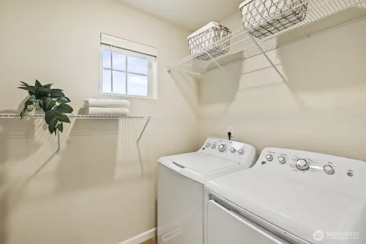 Upstairs laundry room and washer and dryer stay!