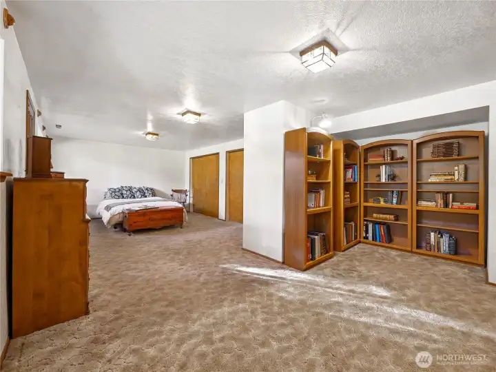 This extremely large room has a bed, but we thought it would be an awesome office/library, crafting/sewing/hobby space! It has two large closets and it's own outside entry.