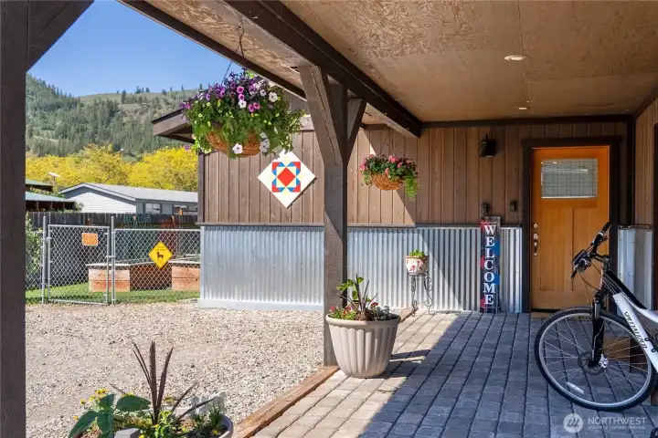 Add a couple Adirondack Chairs and the gracious entry doubles as a shady seating area with views of the surrounding hills.