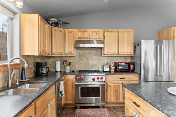 The 'leathered' granite counters, tiled backsplash and high-end appliances are a cook's dream.