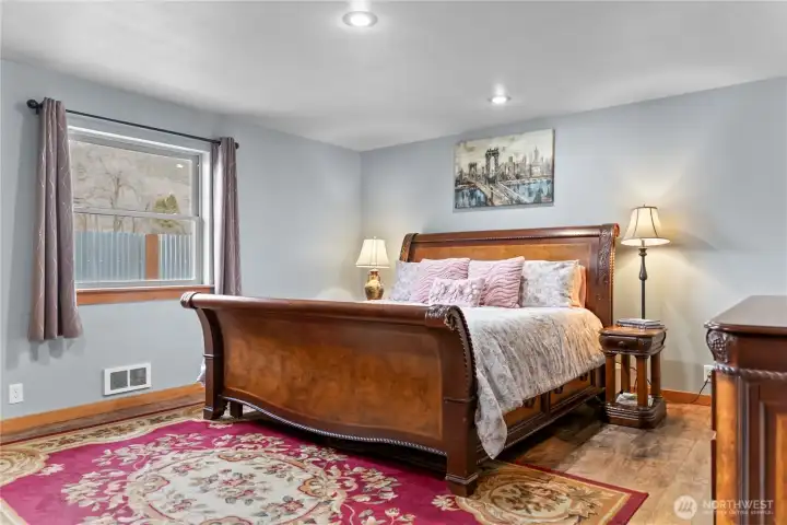 The primary bedroom is large enough for dressing, a seating area and connects to an en suite bathroom.