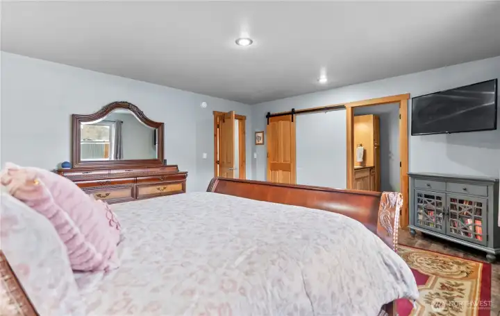 It features a large walk-in closet with sliding barn door.