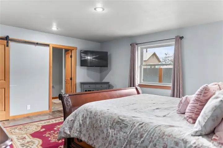 The primary bedroom has peekaboo views of the surrounding neighborhood.