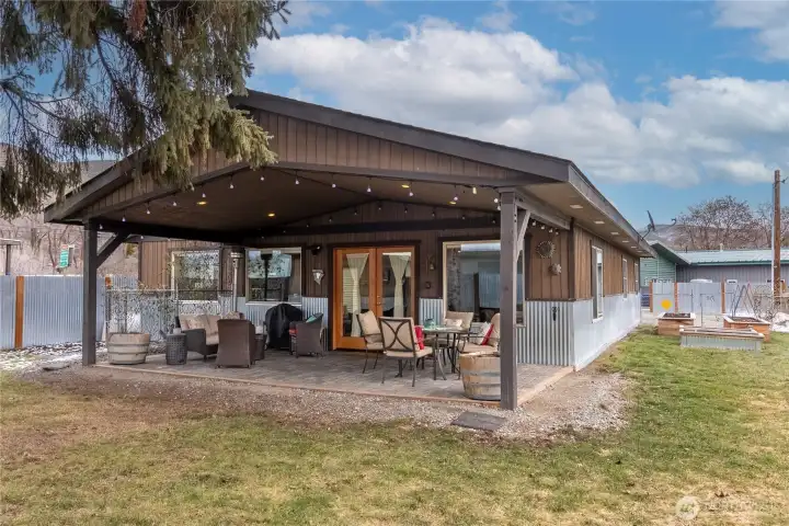 The covered porch is a key feature of the private back yard.