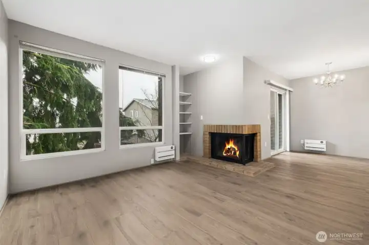 The living/dining/kitchen is warm and inviting and flows out to the private balcony.