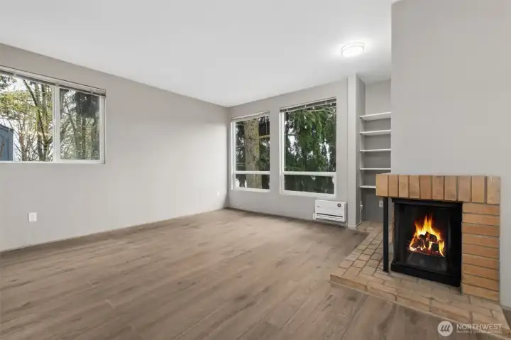 The wood burning fireplace and built in shelving are lovely focal points!