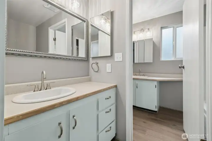The full bath includes a private space off the bedroom for owner use that features a sink and tub. The remaining part is a sink, toilet,  washer  and dryer.
