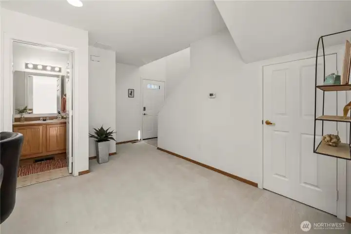 Entry with half bath on left