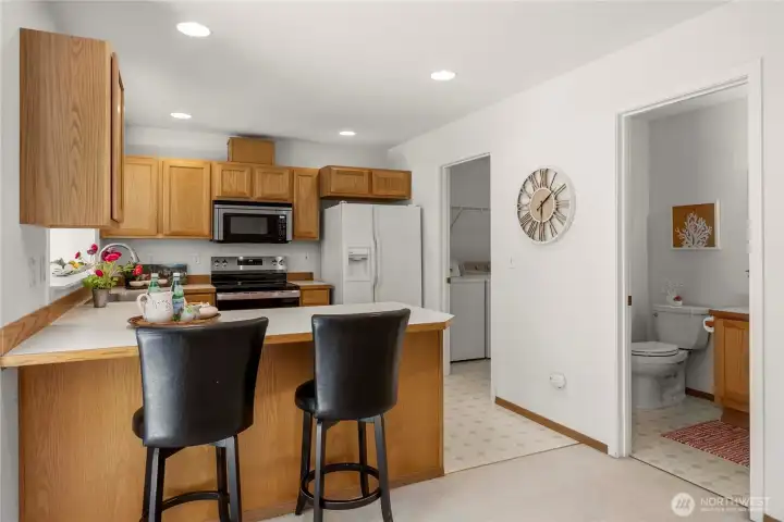 Door to half bath and utility room