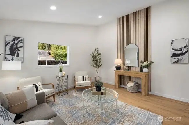 As you enter the front door, the vaulted ceilings welcome you to this bright, airy living room.