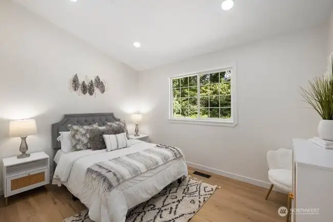 The 2nd bedroom also enjoys vaulted ceilings and a bright, airy feel.