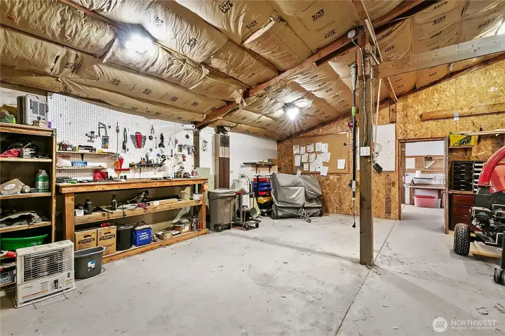 Heated Barn Space | Opportunities for feed storage, tack room, and equipment organization. Heated Barn Space | Opportunities for feed storage, tack room, and equipment organization.