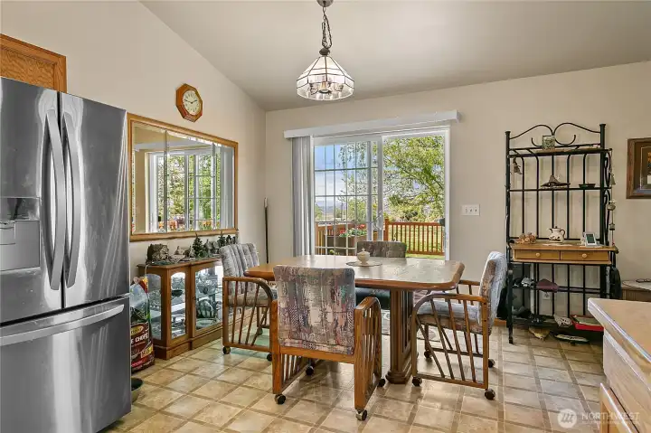 Easy Deck Access | Bright dining spaces overlook the surrounding property. Easy Deck Access | Bright dining spaces overlook the surrounding property.