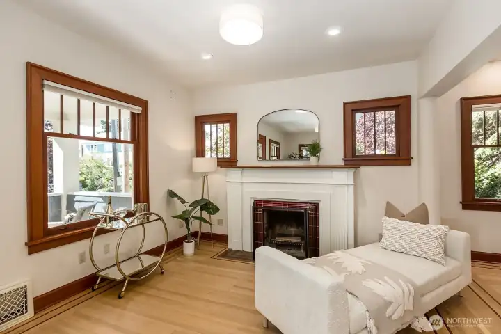 Cozy wood burning fireplace, charming mantle and tile work.