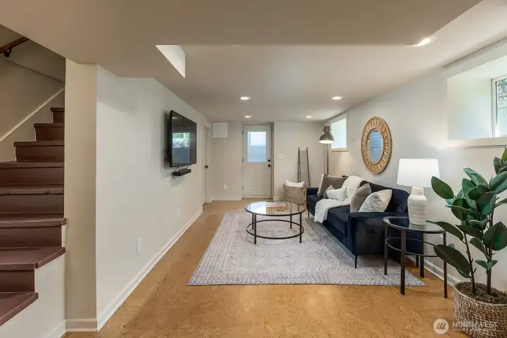 Lower level media room with cork flooring and tons of light!