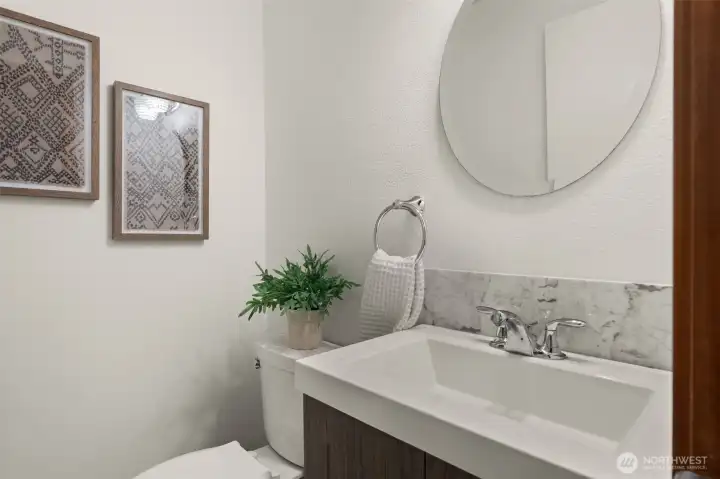 Well-appointed powder room provides convenience for guests and everyday use Well-appointed powder room provides convenience for guests and everyday use