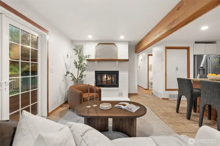 Fireplace and deck access create a functional space for relaxing and entertaining. Fireplace and deck access create a functional space for relaxing and entertaining.