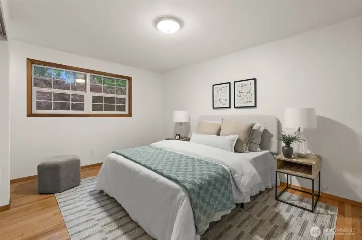 Bedroom provides a comfortable retreat with a large window and views of the surrounding trees. Bedroom provides a comfortable retreat with a large window and views of the surrounding trees.